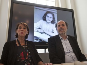 Teresien da Silva, left, and Ronald Leopold of the Anne Frank Foundation wait for the start of their press conference where the Foundation and two Dutch historical institutes promised to announce "new information about the diary" at the Anne Frank House in Amsterdam, Netherlands, Tuesday, May 15, 2018.