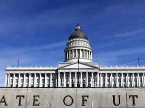 FILE - This March 8, 2018, file photo, shows the exterior of the Utah State Capitol in Salt Lake City. Most of the more than 500 laws passed by the state's Legislature this year go into effect Tuesday, May 8, 2018, 60 days after the end of the short legislative session. The laws are wide-ranging. Some add new protections for runaway teens and people with dangerous partners. Another transforms the state's transit agency,