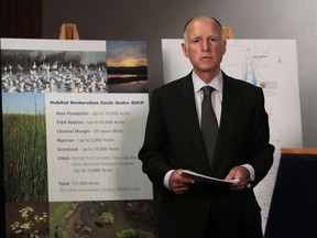 FILE - In this July 25, 2012, file photo, California Gov. Jerry Brown waits for the start of a news conference in Sacramento, Calif., to announce plans to build a giant twin tunnel system to move water from the Sacramento-San Joaquin River Delta to farmland and cities. The Santa Clara Valley Water District board may reverse an earlier decision and grant its full support to Gov. Jerry Brown's controversial plan to build two massive tunnels to remake the state's water system.