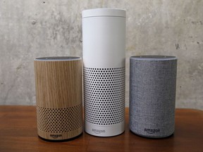 FILE - In this Sept. 27, 2017, file photo, Amazon Echo Plus, center, and other Echo devices sit on display during an event announcing several new Amazon products by the company in Seattle. Amazon says an "unlikely" string of events prompted its Echo personal assistant device to record a Portland, Ore., family's private conversation and then send the recording to an acquaintance in Seattle.