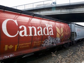 A train hauling grain passes through Calgary,