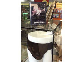 A case feature the DVD of the movie "Cinderella Man" and the jockstrap worn by actor Russell Crowe in the movie are displayed at the Blockbuster video store in Anchorage, Alaska, on Wednesday, May 2, 2018. HBO's John Oliver bought the jockstrap and other items at auction and sent them to Anchorage, in hopes it would help one of the nation's last Blockbuster locations stave off pressure from streaming movie services.