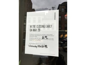 This Sunday, May 27, 2018, photo shows a sign displayed at a Starbucks cafe in Portland, Maine, reminding customers that the store will be closed Tuesday for training.