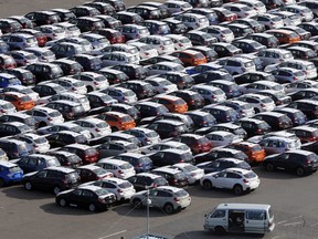 FILE - In this Dec. 20, 2012 photo, cars for export park at a port in Kawasaki, west of Tokyo. China and Japan both condemned Thursday, May 24, 2018 the Trump administration's decision to launch an investigation into whether tariffs are needed on imports of vehicles and automotive parts into the United States.