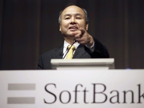 FILE - In this Nov. 4, 2014 file photo, SoftBank founder and Chief Executive Officer Masayoshi Son speaks during a news conference in Tokyo.  Japanese technology company SoftBank Group Corp. said Wednesday, May 9, 2018 its quarterly profit fell but says its fortunes will change dramatically if reported deals come through.