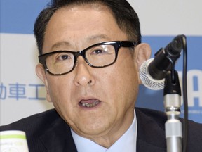 Toyota Motor Corp. chief Akio Toyoda speaks to reporters in Tokyo, Friday, May 18, 2018.  Toyoda, tapped to head the Japanese auto industry association, promised Friday to lead a push among manufacturers to keep a competitive edge in emerging technologies such as zero-emission and autonomous driving.