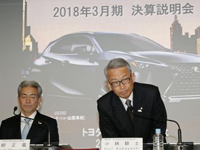 Koji Kobayashi, right, executive vice president of Toyota Motor Corp., and Senior Managing Officer Masayoshi Shirayanagi, attend a press conference on the automaker's quarterly result in Tokyo Wednesday, May 9, 2018. Toyota Motor Corp. is reporting its quarterly profit rose 21 percent as cost cuts and booming sales in some markets offset the damage from higher U.S. incentives.  Toyota, which makes the Camry sedan, Prius hybrid and Lexus luxury models, reported Wednesday January-March profit of 480.8 billion yen ($4.4 billion), up from 398 billion yen the same quarter the previous year.