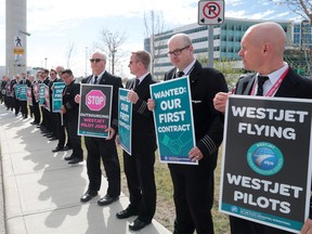 About 150 WestJet pilots protested at outside the company's headquarters in Calgary during the WestJet annual general meeting.