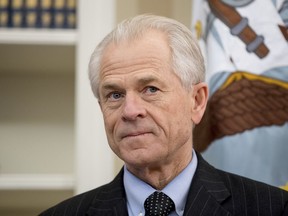 FILE - In this March 31, 2017 file photo, National Trade Council adviser Peter Navarro appears before President Donald Trump arrives to sign executive orders regarding trade in the Oval Office at the White House in Washington. After striking a delicate deal with the United Arab Emirates on rules for airline competition, the Trump administration went to war with itself about what the agreement actually said. White House trade adviser Peter Navarro repeatedly contradicted the State Department's carefully crafted script. Behind the scenes, a dizzying scene of one-upmanship, word games and subtle subterfuge played out, magnified by lobbyists seeking to exploit divisions within the Trump administration.