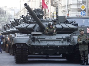 Russian T-72 tanks stand in line prior to a rehearsal for the Victory Day military parade which will take place at Dvortsovaya (Palace) Square on May 9 to celebrate 73 years after the victory in WWII, in St.Petersburg, Russia, Monday, April 30, 2018.