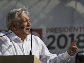 FILE - In this April 20, 2018 file photo, presidential candidate Andres Manuel Lopez Obrador, with the MORENA party, speaks to supporters during his campaign rally in Milpa Alta in Mexico City. Business groups are again taking out newspaper ads to indirectly attack the leftist presidential front-runner ahead of July 1 general elections.
