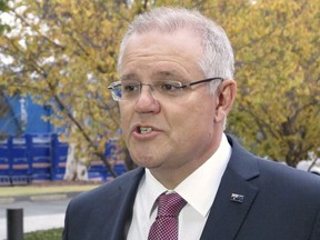 Australia's Treasurer Scott Morrison addresses reporters outside Parliament House in Canberra, Australia, on Tuesday, May 8, 2018. Morrison is expected to release spending plans with a focus on winning votes at an election due within a year.