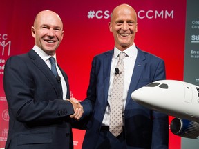Bombardier President and CEO Alain Bellemare, left, shakes hands with Airbus CEO Tom Enders shake hands during a business meeting in Montreal, Friday, October 20, 2017.
