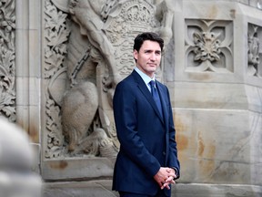 Prime Minister Justin Trudeau waits for the arrival of President of France Emmanuel Macron on Parliament Hill for a visit in Ottawa on Wednesday, June 6, 2018.