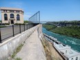 The Niagara River flows past the offices, control centre, and lower river level turbine and generator facility at the Ontario Power Generation Sir Adam Beck Generating Station in Niagara Falls, Ontario.