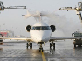 A Bombardier CRJ 900 plain gets de-iced in Germany.