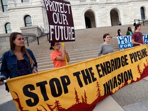 Tribal and environmental groups opposed to the proposed Enbridge Line 3 project rally Thursday, Sept. 28, 2017 at the State Capitol in St. Paul, Minn.