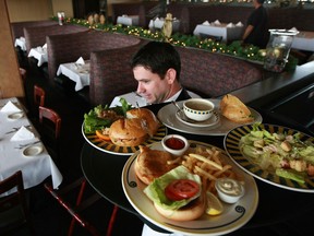 A waiter at a San Francisco restaurant in 2008. Servers are disappearing from restaurants in the Bay Area as the high cost of living drives lower-wage workers away, and eateries can't afford to hire them.