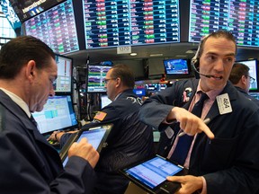 Traders at the Nasdaq exchange.