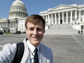 In this Aug. 2, 2017 photo released by Jamie Dupree, Dupree, a Cox Media Group radio reporter, poses in front of the U.S. Capitol in Washington. Two years ago, Dupree encountered what others in his profession might see as an unsurmountable challenge: He lost his voice. Now he may have found a solution. A Scottish company that creates text-to-speech technology has crafted a new "voice" for Dupree: software turns his typed sentences into spoken words.