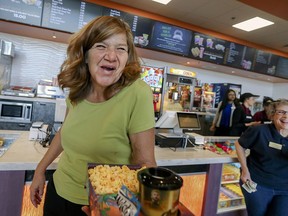 In this May 17, 2018 photo, Linda Hylton, right, says "This is great, we don't have to drive far," as she and her friend, Ginda Adkins, left, attend the opening of at the Maya Cinemas Theater in Delano, Calif.For around a decade, the farm worker city of Delano, has lacked a movie theater. Residents from this largely Latino community had to travel nearly 40 miles to see the latest film a drive advocates say was rare since around a third of the population lives in poverty. Moctesuma Esparza, a well-known Latino movie producer, opened his latest Maya Cinemas theater in May 2018 in the Central California city of 53,000 people as part of his ongoing effort to open movie theaters in poor, U.S. rural areas that lack basic entertainment options.