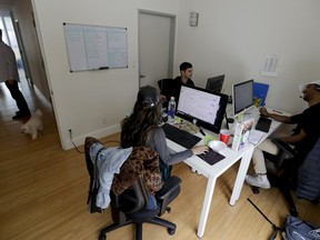 In this Thursday, May 31, 2018, photo, people work in the offices of HeyTutor, an online company that matches tutors with students in Los Angeles. At 19 years old Ryan Neman started HeyTutor with Skyler Lucci. Neman was younger than many tutors he hired. "It's hard to interview someone who looks significantly older than you," Neman said.