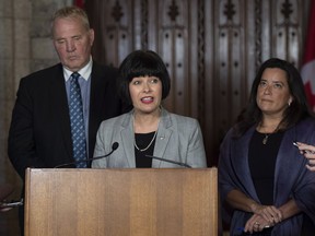 Minister of Health Ginette Petitpas Taylor, centre, Minister of Justice and Attorney General of Canada Jody Wilson-Raybould, right, and Parliamentary Secretary to the Minister of Justice and Attorney General of Canada and to the Minister of Health Bill Blair, left, speak about the new legislation.