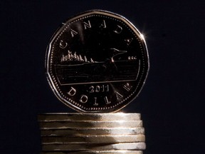 Canadian dollars are pictured in Vancouver on September 22, 2011. The Candian dollar was trading lower after U.S. President Donald Trump continued his attacks on Canada and Prime Minister Justin Trudeau. Trump complained that he had been blindsided by Trudeau's criticism of his tariff threats at a summit-ending news conference.