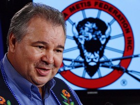 David Chartrand, president of the Manitoba Metis Federation, takes part in a press conference on Parliament Hill in Ottawa on Friday March 8, 2013. The Manitoba Metis Federation has followed through on a promise to launch legal action against the provincial government over hydroelectric development.