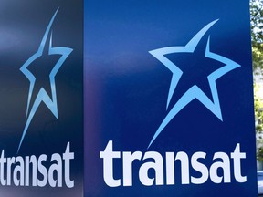 An Air Transat sign is seen in Montreal on May 31, 2016. Air Transat has signed a deal with AerCap for the long-term lease of seven new Airbus aircraft. Financial terms of the deal were not immediately disclosed.