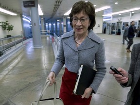 Sen. Susan Collins, R-Maine, walks to the senate floor, Thursday, Feb. 8, 2018, at Capitol Hill in Washington. A Republican senator is trying to ease tensions in Canada's ongoing trade battles with the United States, turning to Twitter on the weekend to call attention to a Maine paper mill that is "truly intertwined" with its cross-border neighbours.