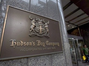 A Hudson's Bay Co. store sign is shown at its Toronto flagship store on July 29, 2013. Hudson's Bay Co. posted a loss of $400 million in its latest quarter compared with a loss of $221 million a year ago.
