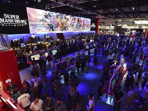 In this photo provided by Nintendo of America, crowds gather on Tuesday, June 12, 2018, at the Nintendo booth at the E3 video game conference in Los Angeles as fans flock to play Super Smash Bros. Ultimate, Pokemon: Let's Go, Pikachu! and Pokemon: Let's Go, Eevee for Nintendo Switch. While information from the annual Electronic Entertainment Expo is still voraciously consumed by gamers hungry for bombshell announcements or updates on anticipated upcoming releases, the ensuing social media talk is as much about what was missing as what was revealed. If the decrease in sexy news out of E3 is vexing to gamers, they may have to get used to it. One leading industry executive says the premier trade event doesn't have the monopoly on video game buzz that it once did. "In our view, E3 has changed," Nintendo of America president and chief operating officer Reggie Fils-Aime said in an interview with