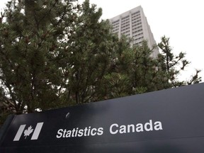 Signage marks the Statistics Canada offices in Ottawa on July 21, 2010. Statistics Canada says the number of people collecting employment insurance in April fell to the lowest level in at least 21 years.
