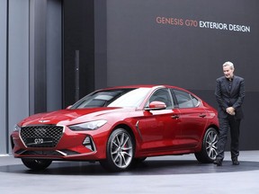 Luc Donckerwolke, a head of Genesis Design Center, speaks to the media next to a new sedan Genesis G70 during its unveiling ceremony in Hwaseong, South Korea on September 15, 2017. DesRosiers Automotive Consultants says sales of new light vehicles in Canada fell again in May, making it the third month in a row with lower sales than the same month last year. A total of 215,407 vehicles were sold, down 0.7 per cent from the May 2017 total of 216,861. It says Canada's year-to-date total of 836,522 new vehicles sold is still almost 1,000 units above the previous year thanks to an abnormally strong January. However, the consulting group based in Richmond Hill, Ont., says the gap won't last if the pattern of market declines continue into the summer months. The newly introduced Genesis brand continues to have strong growth, up 126 per cent from low volumes, with the recent introduction of its G70 sedan starting to pick up speed.