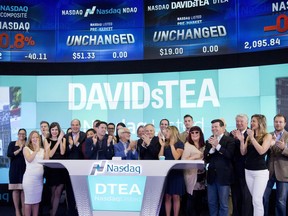Employees and guests of DavidsTea celebrate the company's IPO at the Nasdaq MarketSite, Friday, June 5, 2015 in New York. Embattled beverage retailer DavidsTea says its net loss more than tripled as sales fell six per cent in the first quarter of its fiscal year.