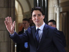 Prime Minister Justin Trudeau waves to a crowd on Parliament Hill in Ottawa on Wednesday, June 6, 2018.