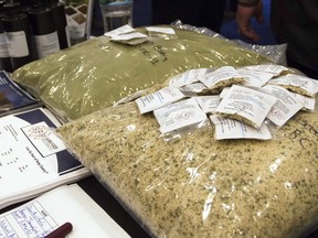 Bags of hemp seeds are displayed on a table next to promotional material at the Cannabis World Congress and Business Exposition, Friday, June 17, 2016 in New York. Marijuana industry titans will gather in New Brunswick next week to discuss how to market cannabis in a competitive legal marketplace -- and other issues raised by the dawn of government-run weed.