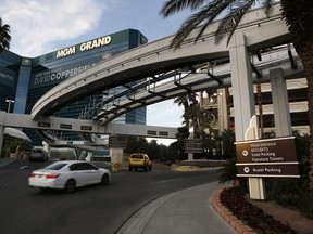 FILE - In this Jan. 14, 2016, photo, cars drive into the MGM Grand hotel and casino in Las Vegas. Thousands of unionized workers at Las Vegas casino-resorts operated by MGM Resorts International are set to approve their newly negotiated five-year contract. The agreement up for a vote Tuesday, June 19, 2018, includes wage increases and stronger protections against sexual harassment for 24,000 bartenders, housekeepers and other members of the Culinary Union.
