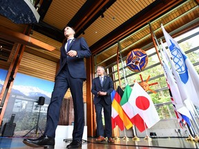 Finance Minister Bill Morneau, left, and Bank of Canada Governor Stephen Poloz leave a press conference during a meeting for the G7 Finance and Central Bank Governors in Whistler, B.C., on Saturday, June 2, 2018.