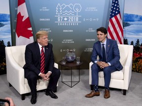 Canada's Prime Minister Justin Trudeau meets with U.S. President Donald Trump at the G7 leaders summit in La Malbaie, Que., on Friday, June 8, 2018.