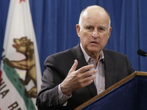 FILE - In this May 11, 2018, file photo, Gov. Jerry Brown discusses his revised 2018-19 state budget at a Capitol news conference in Sacramento, Calif. Brown is preparing to sign a $139 billion budget that marks a stark turnaround for a state he inherited in the throes of a financial crisis. Brown will sign a spending plan Wednesday, June 27, 2018, in Los Angeles that boosts state savings to $16 billion thanks to a massive budget surplus. The budget boosts funding for higher education, increases welfare grants and creates more slots for subsidized child care.
