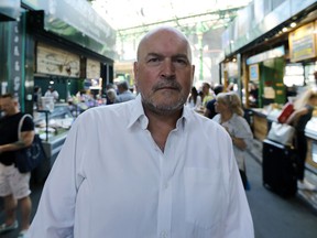 In this photo taken on Wednesday, June 27, 2018, Donald Hyslop, Chair of Trustees at Borough Market, speaks to the Associated Press in Borough Market in London. Seven historic food and drink markets are creating an alliance to promote the sale of local produce. London's Borough Market said Thursday, June 28, 2018 it will partner with La Boqueria in Barcelona, Markthalle Neun in Berlin, Central Market Hall in Budapest, Sydney Fish Market in Sydney, Queen Victoria Market in Melbourne, and Pike Place Market in Seattle.