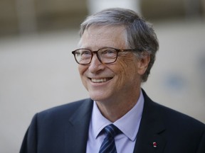 FILE - In this April 16, 2018, file photo, Bill Gates, Co-Chair of the Bill & Melinda Gates Foundation, talks to the media after a meeting with French President Emmanuel Macron at the Elysee Palace in Paris. The Seattle region is home to the two richest men in America, but while Amazon's Jeff Bezos is blamed by some for rising rents and clogged city streets, Gates is largely admired for helping lead the computing revolution and for the billions he donates through his philanthropy.