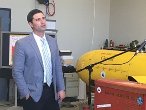 Nova Scotia Minister of Energy Geoff MacLellan watches video on the undersea exploration for oil during an announcement at the Bedford Institute if Oceanography in Halifax on Wednesday, June 20, 2018. Nova Scotia's government will invest $11.8 million on geoscience research over the next four years to encourage offshore oil exploration.
