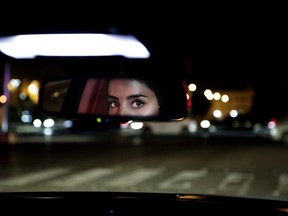 Hessah al-Ajaji drivers her car down the capital's busy Tahlia Street after midnight for the first time in Riyadh, Saudi Arabia, Sunday, June 24, 2018. Saudi women are in the driver's seat for the first time in their country and steering their way through busy city streets just minutes after the world's last remaining ban on women driving was lifted on Sunday.