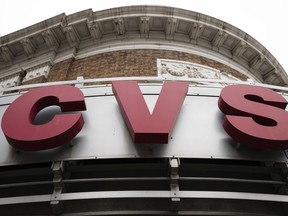 FILE - This Oct. 21, 2016, file photo shows a CVS drugstore and pharmacy location in Philadelphia. CVS Health is making prescription deliveries available from its stores nationwide, as retailers continue to adjust to a growing threat from the online giant Amazon.