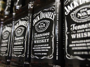 FILE - In this Dec. 5, 2011, file photo, bottles of Jack Daniel's Tennessee Whiskey line the shelves of a liquor outlet in Montpelier, Vt. Brown-Forman Corp. (BF.A) on Wednesday, June 6, 2018, reported fiscal fourth-quarter earnings of $110 million.
