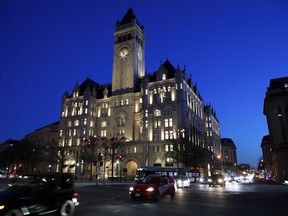 FILE- This Jan. 30, 2018, file photo shows the Trump International Hotel in Washington. President Donald Trump's hotel company did not break the law by doing business with other countries, a Justice Department lawyer told a federal judge Monday, June 11. The state of Maryland and the District Columbia have accused Trump of capitalizing on the presidency and causing harm to local businesses that compete with his Washington hotel.