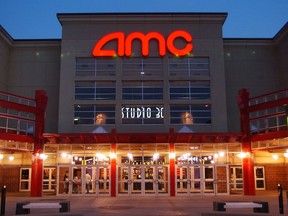 FILE - In this May 11, 2005, file photo, people enter AMC's Studio 30 theater in Olathe, Kan. AMC Theatres, the world's largest movie theater chain, has unveiled a $20-a-month subscription service to rival the flagging MoviePass. The theater chain on Wednesday announced a new service to its loyalty program, AMC Stubs, allowing subscribers to see up to three movies a week for a monthly fee of $19.95.